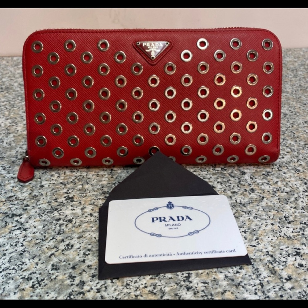 Prada Red Saffiano leather grommet Zippy wallet